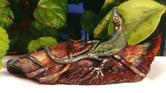 A gecko on a log